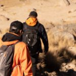 Anti-Theft Backpacks - Two people walking down a rocky trail with backpacks