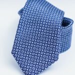 Tie - Blue Necktie on White Surface
