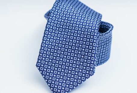 Tie - Blue Necktie on White Surface