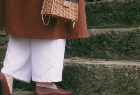 Loafers - Woman Holding a Wicker Bag Walking Up the Steps