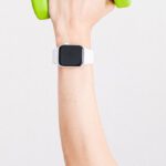 Digital Watch - Person Wearing White Apple Watch While Holding Green Dumbbell