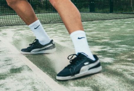 Athletic Shoes - Close-up Photo of Man Standing on Tennis Court